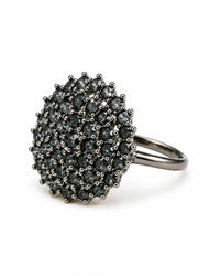 Silver ring with black gemstones on a white background
