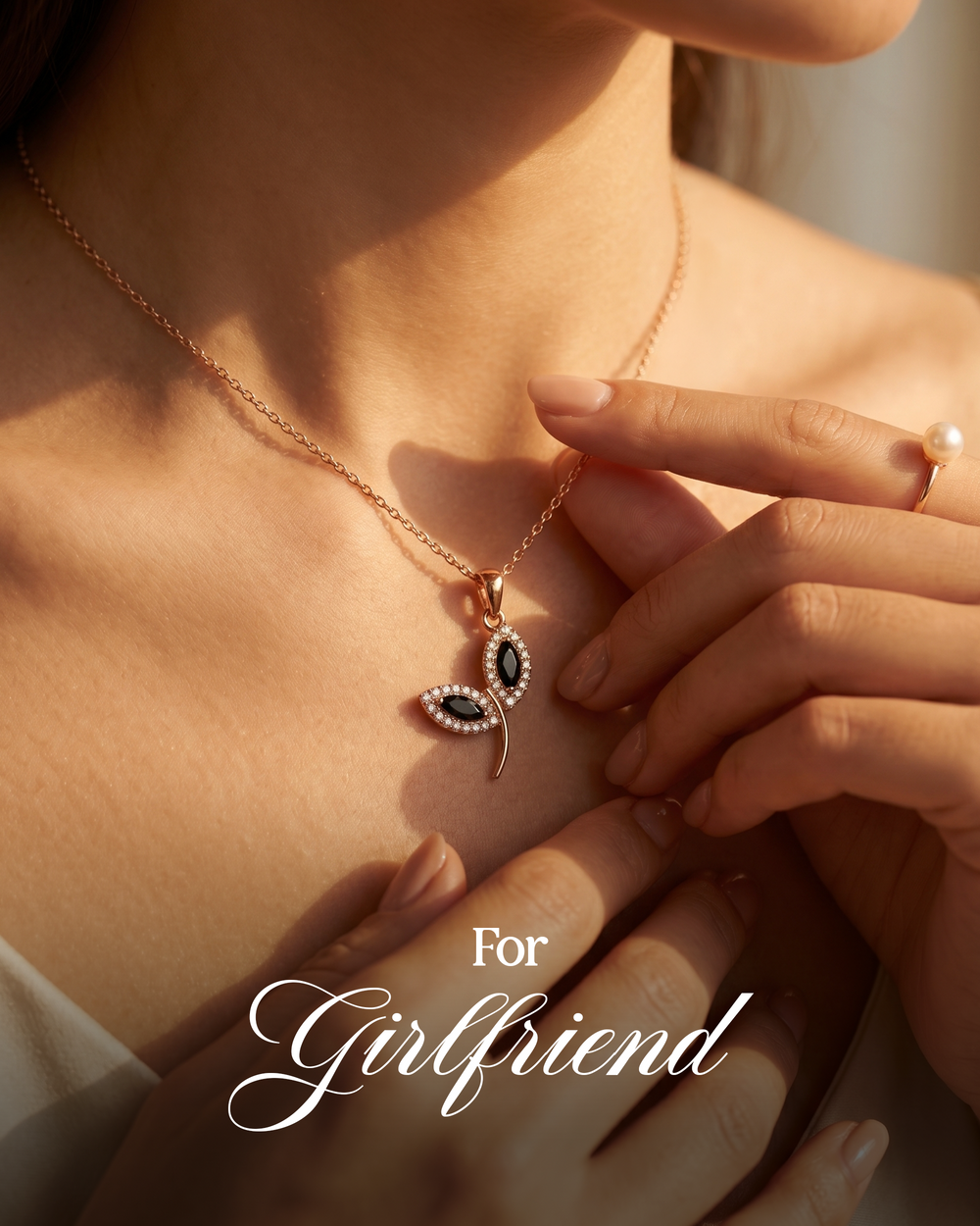 Close-up of a necklace with a pendant, held by a hand, with 'For Girlfriend' text.