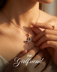 Close-up of a necklace with a pendant, held by a hand, with 'For Girlfriend' text.