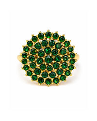 Gold ring with green gemstones on a white background