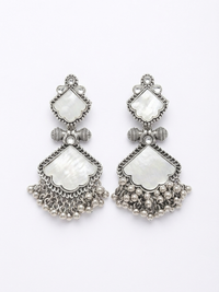 Pair of silver earrings with white stones on a white background