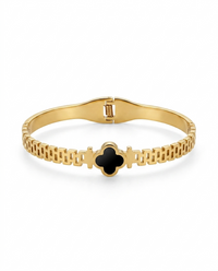 Goldden bracelet with a black clover design on a white background