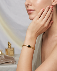 modal shoots wearing goldden bracelets. Noirvine bracelet