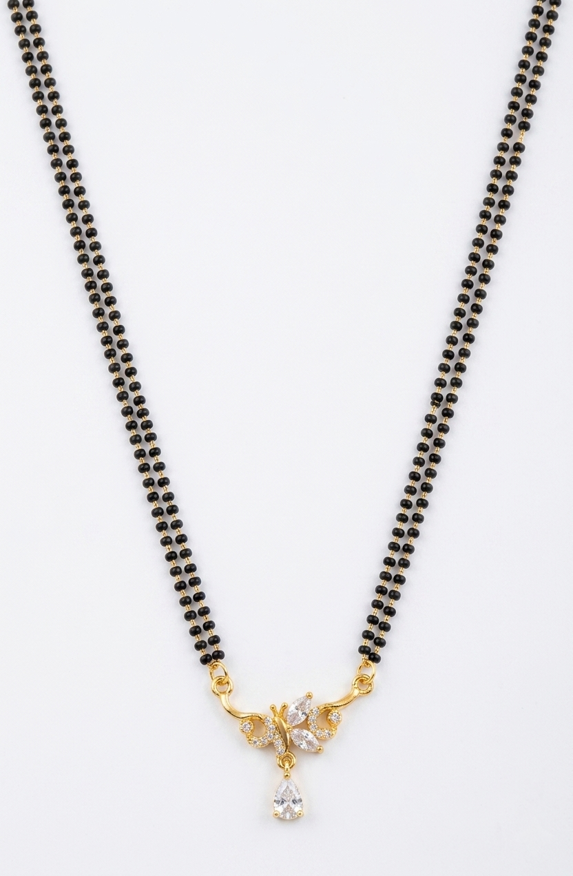 Black beaded necklace with a gold and crystal pendant on a white background