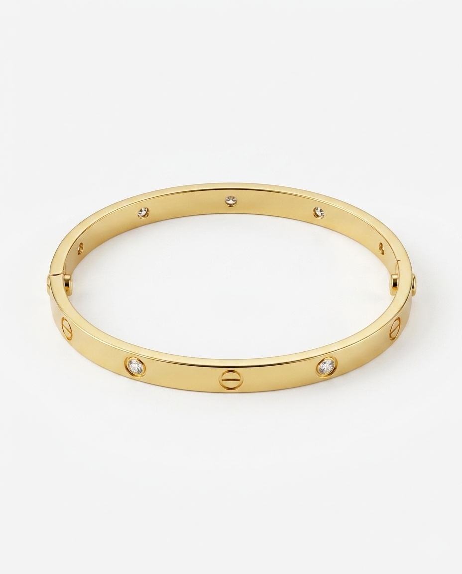 Gold bracelet with embedded stones on a white background