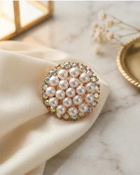 Pearl decorative ring on a marble surface with a soft focus background