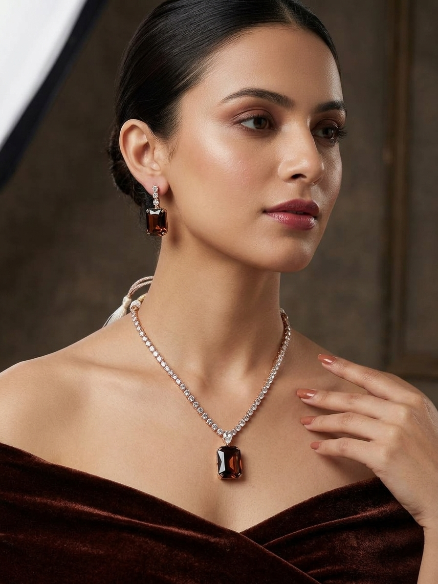 Woman wearing a necklace and earrings with a brown background