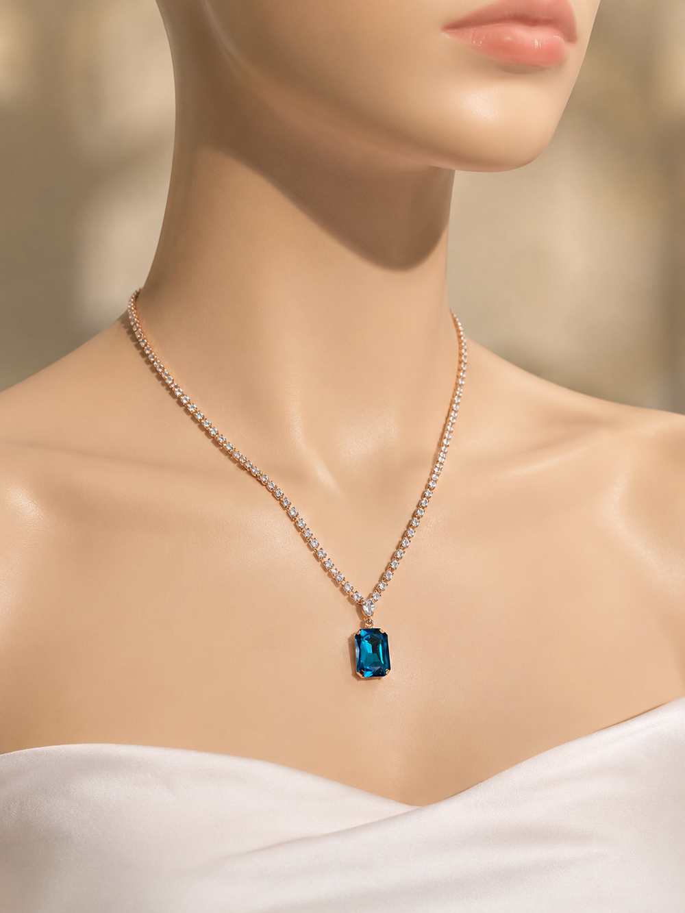 Necklace with a blue gemstone on a mannequin