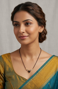 Woman wearing a traditional saree with a plain background