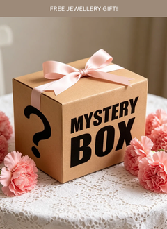 Mystery box with a pink ribbon and pink flowers on a white lace tablecloth